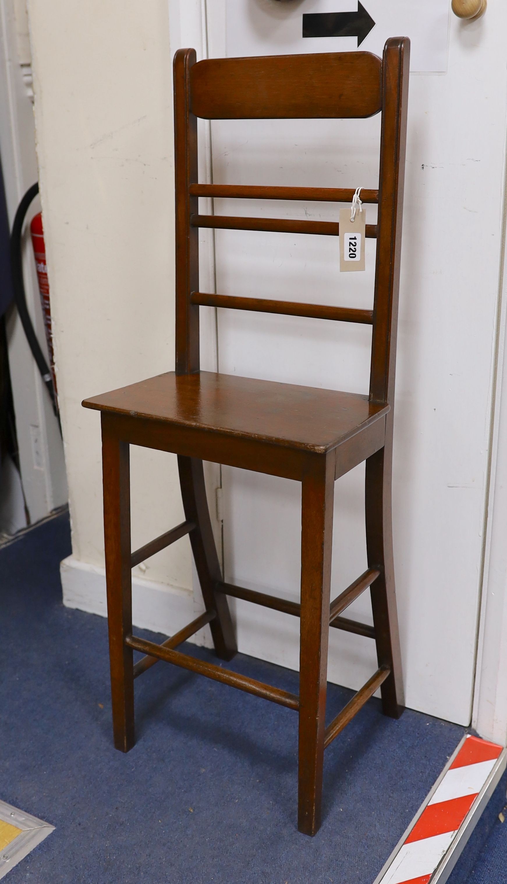 A 19th century mahogany correction chair, width 33cm, depth 20cm, height 90cm